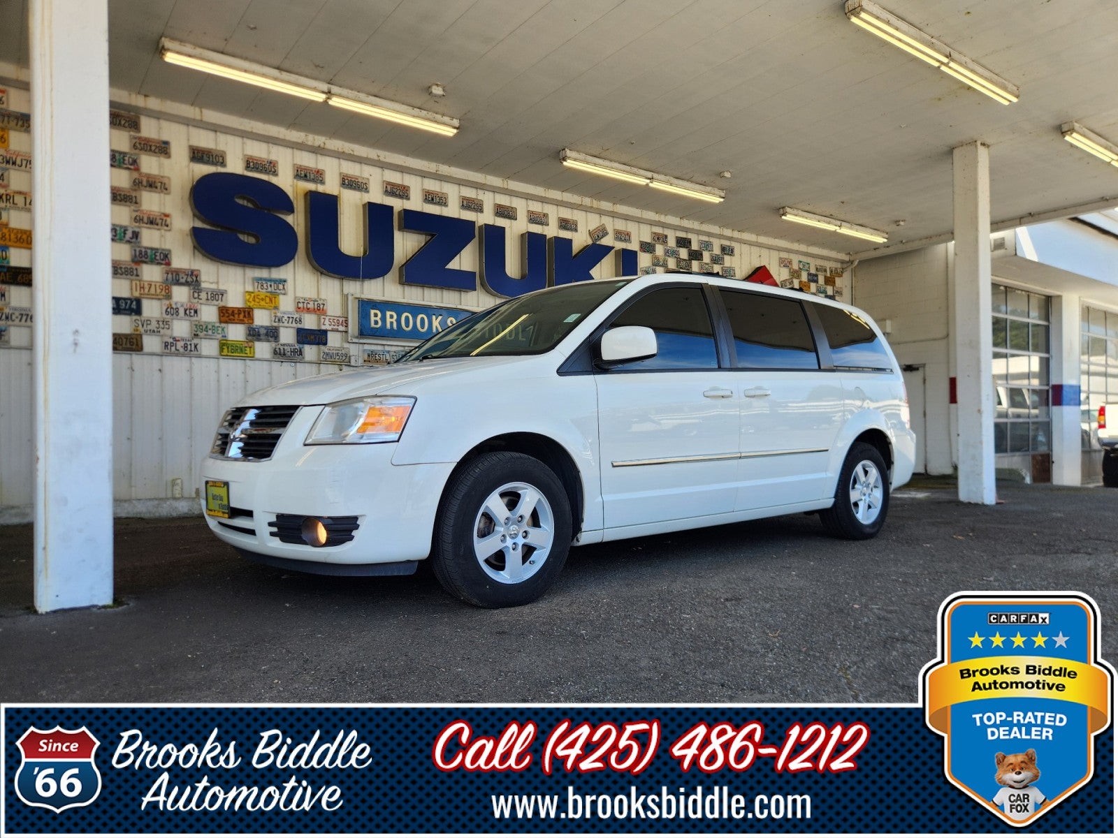 2010 Dodge Grand Caravan SXT in Stone White — front three-quarter view